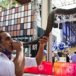 
              A man blows a shofar, a musical instrument made from an animal horn, after a speech by Israeli President Isaac Herzog at Expo 2020 in Dubai, United Arab Emirates, Monday, Jan. 31, 2022. The UAE intercepted a ballistic missile fired by Yemen's Houthi rebels early Monday as the Israeli president visited the country, authorities said, the third such attack in recent weeks. (AP Photo/Jon Gambrell)
            