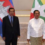 
              In this photo provided by An Khoun Sam Aun/National Television of Cambodia, Cambodian Prime Minister Hun Sen, left, poses for photographs together with Myanmar State Administration Council Chairman, Senior General Min Aung Hlaing, right, before holding a meeting in Naypyitaw, Myanmar, Friday Jan. 7, 2022. Cambodian Prime Minister Hun Sen's visit to Myanmar seeking to revive peace efforts after last year's military takeover has provoked an angry backlash among critics, who say he is legitimizing the army's seizure of power. (An Khoun SamAun/National Television of Cambodia via AP)
            