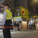 
              FILE - A police officer stands guard outside a pet store that was closed after some pet hamsters were, authorities said, tested positive for the coronavirus, in Hong Kong on Jan. 18, 2022. The city is culling small animals including hamsters and chinchillas and halting their import and sales after several hamsters in the pet shop tested positive for the coronavirus.(AP Photo/Kin Cheung, File)
            