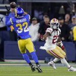 
              Los Angeles Rams' Travin Howard (32) intercepts a pass in front of San Francisco 49ers' JaMycal Hasty during the second half of the NFC Championship NFL football game Sunday, Jan. 30, 2022, in Inglewood, Calif. (AP Photo/Marcio Jose Sanchez)
            