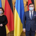 
              In this photo provided by Ukrainian Foreign Ministry Press Office, Ukrainian Foreign Minister Dmytro Kuleba, right, and German Foreign Minister Annalena Baerbock pose for a photo during their meeting in Kyiv, Ukraine, Monday, Jan. 17, 2022. (Ukrainian Foreign Ministry Press Office via AP)
            
