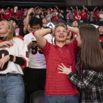 
              Fans celebrate at the University of Georgia's coliseum in Athens, Ga., as Georgia wins the College Football Playoff championship game against Alabama on Monday, Jan. 10, 2022. (AP Photo/Ben Gray)
            