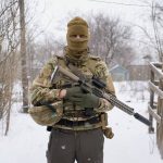 
              A Ukrainian sniper poses for a photo before moving to a position on the front line in the Luhansk region, eastern Ukraine, Friday, Jan. 28, 2022. High-stakes diplomacy continued on Friday in a bid to avert a war in Eastern Europe. The urgent efforts come as 100,000 Russian troops are massed near Ukraine's border and the Biden administration worries that Russian President Vladimir Putin will mount some sort of invasion within weeks. (AP Photo/Vadim Ghirda)
            