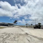 
              In this photo provided by the Australian Defence Force, a Royal Australian Air Force C-17A Globemaster III aircraft is parked at Fua'amotu International Airport near Nukuʻalofa, Tonga, Thursday, Jan. 20, 2022. The first flights carrying fresh water and other aid to Tonga were finally able to land after the Pacific nation's main airport runway was cleared of ash left by a huge volcanic eruption. (Australian Defence Force via AP)
            