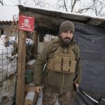 
              An Ukrainian serviceman looks around as he leaves a shelter on the front line in the Luhansk region, eastern Ukraine, Friday, Jan. 28, 2022. High-stakes diplomacy continued on Friday in a bid to avert a war in Eastern Europe. The urgent efforts come as 100,000 Russian troops are massed near Ukraine's border and the Biden administration worries that Russian President Vladimir Putin will mount some sort of invasion within weeks. (AP Photo/Vadim Ghirda)
            