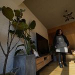 
              A local resident hired as a cleaner for a traditional courtyard house turned into lodging for tourists, inspects one of the room in Houheilong Miao, a village in Yanqing on the outskirts of Beijing, China, Wednesday, Jan. 5, 2022. The village has a view of the Olympics skiing venue in the distance. Its 20 mostly vacant traditional courtyard houses have been turned into lodgings and a cafe dubbed the "Winter Olympic Home." (AP Photo/Ng Han Guan)
            