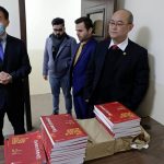 
              Chinese lecturer, Zhiwei Hu, left, teachers and officials of the Chinese Language Department stand in front of Chinese language books intended for students in Salahaddin University in Irbil, Iraq, Wednesday, Jan. 19, 2021. The Chinese language school in northern Iraq is attracting students who hope to land jobs with a growing number of Chinese companies in the oil, infrastructure, construction, and telecommunications sectors in the region. (AP Photo/Khalid Mohammed)
            