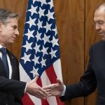 
              Secretary of State Antony Blinken greets Russian Foreign Minister Sergey Lavrov before their meeting, Friday, Jan. 21, 2022, in Geneva, Switzerland. (AP Photo/Alex Brandon, Pool)
            