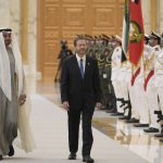 
              President Isaac Herzog, walks with the Crown Prince of Abu Dhabi, Sheikh Mohammed bin Zayed Al Nahyan, left, as they review an honor guard, at the royal palace, in Abu Dhabi, United Arab Emirates, Sunday, Jan. 30, 2022. Israel's president arrived in the United Arab Emirates on Sunday in the first official visit by the country's head of state, the latest sign of deepening ties between the two nations as tensions rise in the region. (Amos Ben Gershom/GPO via AP)
            