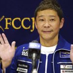 
              Japanese billionaire Yusaku Maezawa waves during a press conference at the Foreign Correspondents’ Club in Tokyo Friday, Jan. 7, 2022. Maezawa has returned from space with hopes of new celestial investments. (AP Photo/Eugene Hoshiko)
            