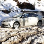 
              A vehicle is stranded on a snow-covered road in a heavy snowfall-hit area in Murree, some 28 miles (45 kilometers) north of the capital of Islamabad, Pakistan, Saturday, Jan. 8, 2022. Temperatures fell to minus 8 degrees Celsius (17.6 Fahrenheit) amid heavy snowfall at Pakistan's mountain resort town of Murree overnight, killing multiple people who were stuck in their vehicles, officials said Saturday. (AP Photo/Rahmat Gul)
            