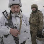 
              Ukrainian servicemen stand in a trench on the front line in the Luhansk area, eastern Ukraine, Thursday, Jan. 27, 2022. The U.S. rejection of Russia's main demands to resolve the crisis over Ukraine left "little ground for optimism," the Kremlin said Thursday, but added that dialogue was still possible. (AP Photo/Vadim Ghirda)
            