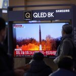 
              People watch a TV screen showing a news program reporting about North Korea's missile launch with a file image, at a train station in Seoul, South Korea, Friday, Jan. 14, 2022. North Korea on Friday fired two short-range ballistic missiles in its third weapons launch this month, officials in South Korea said, in an apparent reprisal for fresh sanctions imposed by the Biden administration for its continuing test launches. (AP Photo/Lee Jin-man)
            