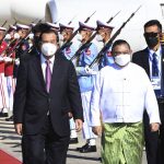 
              In this photo provided by An Khoun Sam Aun/National Television of Cambodia, Cambodian Prime Minister Hun Sen, front left, reviews an honor guard with Myanmar Foreign Minister Wunna Maung Lwin, front right, on his arrival at Naypyitaw International Airport in Naypyitaw, Myanmar, Friday, Jan 7, 2022. (An Khoun Sam Aun/National Television of Cambodia via AP)
            