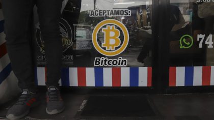 FILE - "We accept Bitcoin" is announced at a barber shop in Santa Tecla, El Salvador, Sept. 4, 2021...