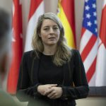
              In this photo provided by Ukrainian National Guard Press Office Canada's Minister of Foreign Affairs Melanie Joly speaks during her visit to the National Guard base close to Kyiv, Ukraine, Tuesday, Jan. 18, 2022. (Ukrainian National Guard Press Office via AP)
            
