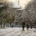 
              People walk in a snow-covered park with the iconic Haghia Sophia in the background at Istanbul, Tuesday, Jan. 25, 2022. Rescue crews in Istanbul and Athens on Tuesday cleared roads that had come to a standstill after a massive cold front and snowstorms hit much of Turkey and Greece, leaving countless people and vehicles in both cities stranded overnight in freezing conditions. (AP Photo/Emrah Gurel)
            