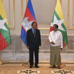 
              In this photo provided by An Khoun Sam Aun/National Television of Cambodia, Cambodian Prime Minister Hun Sen, left, poses for photographs together with Myanmar State Administration Council Chairman, Senior General Min Aung Hlaing, right, before holding a meeting in Naypyitaw, Myanmar, Friday Jan. 7, 2022. Cambodian Prime Minister Hun Sen's visit to Myanmar seeking to revive peace efforts after last year's military takeover has provoked an angry backlash among critics, who say he is legitimizing the army's seizure of power. (An Khoun SamAun/National Television of Cambodia via AP)
            