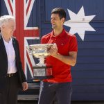 
              Serbia's Novak Djokovic, right, stands with Australian Open tournament director Craig Tiley for a trophy photo shoot following his win the Australian Open tennis championships in Melbourne, Australia, Monday, Feb 22, 2021. The No. 1-ranked Djokovic was denied entry at the Melbourne airport late Wednesday, Jan 5, 2022, after border officials canceled his visa for failing to meet its entry requirement that all non-citizens be fully vaccinated for COVID-19. (AP Photo/Hamish Blair)
            