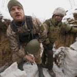 
              Ukrainian servicemen check their position in a trench on the front line in the Luhansk region, eastern Ukraine, Friday, Jan. 28, 2022. High-stakes diplomacy continued on Friday in a bid to avert a war in Eastern Europe. The urgent efforts come as 100,000 Russian troops are massed near Ukraine's border and the Biden administration worries that Russian President Vladimir Putin will mount some sort of invasion within weeks. (AP Photo/Vadim Ghirda)
            