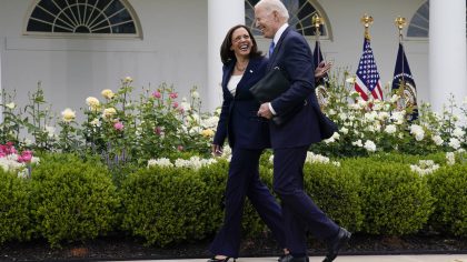FILE - President Joe Biden walks with Vice President Kamala Harris after speaking on updated guidan...