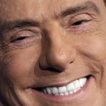 
              FILE - Italian former Premier and Forza Italia (Go Italy) party leader, Silvio Berlusconi, smiles during the recording of the Italian state television RAI, Porta a Porta (Door To Door) TV talk show in Rome Thursday, Jan. 11, 2018. Italy is poised to elect a new president, a figure who is supposed to serve as the nation's moral compass and foster unity by being above the political fray. Silvio Berlusconi thinks he fits the bill. (AP Photo/Andrew Medichini, File)
            