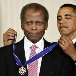 
              REMOVES REFERENCE TO THE BAHAMAS - FILE - President Barack Obama presents the 2009 Presidential Medal of Freedom to Sidney Poitier during ceremonies in the East Room at the White House in Washington on, Aug. 12, 2009.  Poitier, the groundbreaking actor and enduring inspiration who transformed how Black people were portrayed on screen, became the first Black actor to win an Academy Award for best lead performance and the first to be a top box-office draw, died Thursday, Jan. 6, 2022. He was 94. (AP Photo/J. Scott Applewhite, File)
            