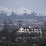 
              A metallurgical plant is seen on the outskirts of the city of Mariupol, Ukraine, Thursday, Feb. 24, 2022. Russia has launched a barrage of air and missile strikes on Ukraine early Thursday and Ukrainian officials said that Russian troops have rolled into the country from the north, east and south. (AP Photo/Sergei Grits)
            