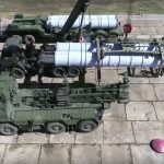 FILE - In this photo taken from video provided by Russian Defense Ministry Press Service, Sept. 12, 2018, Military personnel prepare Russian air defense missile systems during the military exercises in the Chita region, Eastern Siberia, during the Vostok 2018 exercises in Russia. Hundreds of thousands Russian troops swept across Siberia in the nation's largest ever war games also joined by China, a powerful show of burgeoning military ties between Moscow and Beijing amid their tensions with the U.S. Amid the soaring tensions over Ukraine, President Vladimir Putin is heading to Beijing on a trip intended to help strengthen Russia's ties with China and coordinate their policies amid Western pressure. (Russian Defense Ministry Press Service via AP, File)
