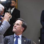 
              Portugal's Prime Minister Antonio Costa, left, speaks with Dutch Prime Minister Mark Rutte during a round table meeting at an extraordinary EU summit on Ukraine in Brussels, Thursday, Feb 24, 2022. Russia launched a wide ranging attack on Ukraine on Thursday, hitting cities and bases with airstrikes or shelling, as civilians piled into trains and cars to flee. (AP Photo/Geert Vanden Wijngaert, Pool)
            