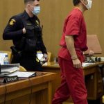 
              Scott Peterson, right, leaves his seat for a break during a hearing at the San Mateo County Superior Court in Redwood City, Calif., Friday, Feb. 25, 2022. (AP Photo/Jeff Chiu, Pool)
            