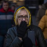 
              A woman reacts to sirens sound announcing new attacks, outside a supermarket in central Kyiv, Ukraine, Monday, Feb. 28, 2022. President Vladimir Putin dramatically escalated East-West tensions by ordering Russian nuclear forces put on high alert following new crippling Western sanctions that forced his Central Bank to sharply raise its key rate Monday to save the ruble from collapse. (AP Photo/Emilio Morenatti)
            