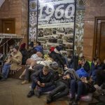 
              People rest in the Kyiv subway, using it as a bomb shelter in Kyiv, Ukraine, Thursday, Feb. 24, 2022. Russia has launched a full-scale invasion of Ukraine, unleashing airstrikes on cities and military bases and sending troops and tanks from multiple directions in a move that could rewrite the world's geopolitical landscape. (AP Photo/Emilio Morenatti)
            