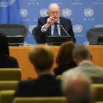 
              Vasily Nebenzya, Russian ambassador to the United Nations, talks to reporters at United Nations headquarters, Monday, Feb. 28, 2022. (AP Photo/Seth Wenig)
            