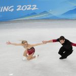 
              Alexa Knierim and Brandon Frazier, of the United States, compete during the pairs short program figure skating competition at the 2022 Winter Olympics, Friday, Feb. 4, 2022, in Beijing. (AP Photo/Jeff Roberson)
            