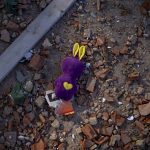 
              A toy amongst the debris near an apartment building damaged following a rocket attack, in Kyiv, Ukraine, Saturday, Feb. 26, 2022. Russian troops stormed toward Ukraine's capital Saturday, and street fighting broke out as city officials urged residents to take shelter. (AP Photo/Emilio Morenatti)
            