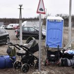 
              Belongings of refugees are seen close to the Hungarian-Ukrainian border in Beregsurany, Hungary, Saturday, Feb 26, 2022. Hungary has extended legal protection to those fleeing the Russian invasion. (AP Photo/Anna Szilagyi)
            