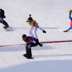 
              United States' Lindsey Jacobellis (5) reacts as she crosses the finish line followed by France's Chloe Trespeuch (8), United States' Stacy Gaskill (4), and Italy's Michela Moioli (1) during the women's cross finals at the 2022 Winter Olympics, Wednesday, Feb. 9, 2022, in Zhangjiakou, China. (AP Photo/Lee Jin-man)
            