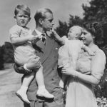 
              FILE - Britain's Queen Elizabeth II, then Princess Elizabeth, stands with her husband Prince Philip, the Duke of Edinburgh, and their children Prince Charles and Princess Anne at Clarence House, the royal couple's London residence, Aug. 1951, Queen Elizabeth II will mark 70 years on the throne Sunday, Feb. 6, 2022, an unprecedented reign that has made her a symbol of stability as the United Kingdom navigated an age of uncertainty. (AP Photo/Eddie Worth, File)
            