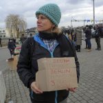 
              German Tanja Shwarcz, 51, holds a sign offering shelter in Hamburg, Germany to Ukrainian refugees arriving at the Medyka border crossing, Poland, Saturday, Feb. 26, 2022. (AP Photo/Visar Kryeziu)
            