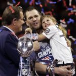 
              FILE - New England Patriots' Tom Brady holds his daughter, Vivian, after the NFL Super Bowl 53 football game against the Los Angeles Rams, Sunday, Feb. 3, 2019, in Atlanta. Tom Brady has retired after winning seven Super Bowls and setting numerous passing records in an unprecedented 22-year-career. He made the announcement, Tuesday, Feb. 1, 2022, in a long post on Instagram.  (AP Photo/Mark Humphrey, File)
            