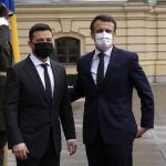 
              French President Emmanuel Macron, right, is welcomed by Ukrainian President Volodymyr Zelenskyy before their talks Tuesday, Feb. 8, 2022 in Kyiv, Ukraine. Diplomatic efforts to defuse the tensions around Ukraine continued on Tuesday with French President Emmanuel Macron in Kyiv the day after hours of talks with the Russian leader in Moscow yielded no apparent breakthroughs. (AP Photo/Thibault Camus, Pool)
            