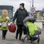 
              Refugees fleeing conflict in Ukraine arrive at the Medyka border crossing in Poland, Monday, Feb. 28, 2022. The head of the United Nations refugee agency says more than a half a million people had fled Ukraine since Russia’s invasion on Thursday. (AP Photo/Visar Kryeziu)
            