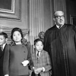 
              FILE - Supreme Court Associate Justice Thurgood Marshall, right, stands with his family as they watch him take his seat at the court for the first time, Oct. 2, 1967. From left are Marshall's son Thurgood, Jr., 11, wife Cecilia Suyat, and son John, 9. Marshall joined the Supreme Court in 1967 as the court's first Black justice. (AP Photo/Henry Griffin, File)
            