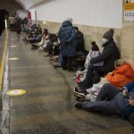 
              People lie in the Kyiv subway, using it as a bomb shelter in Kyiv, Ukraine, Thursday, Feb. 24, 2022. Russia has launched a full-scale invasion of Ukraine, unleashing airstrikes on cities and military bases and sending troops and tanks from multiple directions in a move that could rewrite the world's geopolitical landscape. (AP Photo/Emilio Morenatti)
            