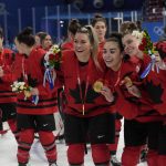
              Canada poses with their gold medals after defeating the United States in the women's gold medal hockey game at the 2022 Winter Olympics, Thursday, Feb. 17, 2022, in Beijing. (AP Photo/Petr David Josek)
            