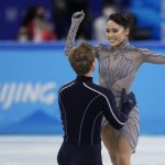 
              Madison Chock and Evan Bates, of the United States, compete in the team ice dance program during the figure skating competition at the 2022 Winter Olympics, Monday, Feb. 7, 2022, in Beijing. (AP Photo/David J. Phillip)
            