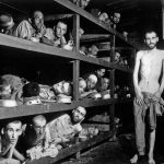 
              FILE - In this photo provided by the U.S. Army, inmates of the German KZ Buchenwald are seen inside their barracks a few days after U.S. troops liberated the concentration camp near Weimar, Germany on April 16, 1945. (U.S. Army via AP)
            