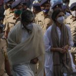 
              Bollywood superstar Amitabh Bachchan along with his daughter Shweta Bachchan Nanda arrives to pay tribute to Lata Mangeshkar, at her home in Mumbai, India, Sunday, Feb.6, 2022. The legendary Indian singer with a prolific, groundbreaking catalog and a voice recognized by a billion people in South Asia, died Sunday morning of multiple organ failure. She was 92. (AP Photo/Rafiq Maqbool)
            