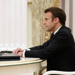 
              French President Emmanuel Macron speaks to Russian President Vladimir Putin during their meeting in the Kremlin in Moscow, Russia, Monday, Feb. 7, 2022. Macron traveled to Moscow in a bid to help defuse tensions amid a Russian troop buildup near Ukraine that fueled fears of an invasion. (Sputnik, Kremlin Pool Photo via AP)
            